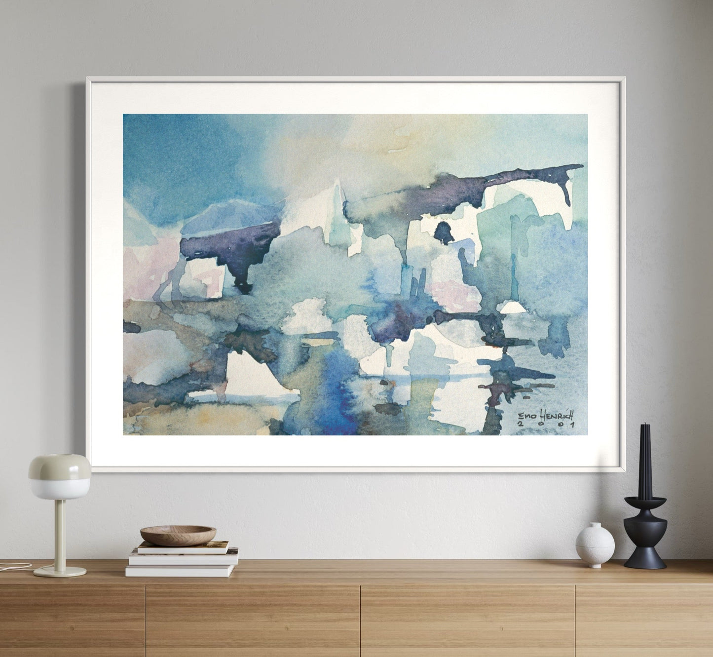 This image features a beautifully framed watercolor painting titled "Jókulsarlon Glacier-Lagoon III" by Emo Henrich. The artwork, created in 2001, depicts an abstract representation of the Jókulsarlon glacier-lagoon, using a palette of soft blues and whites that evoke the serene and expansive landscape.